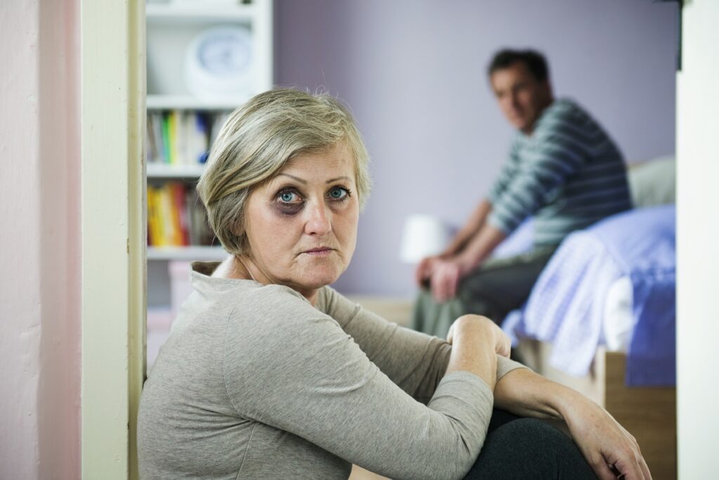 woman sitting with black eye domestic violence