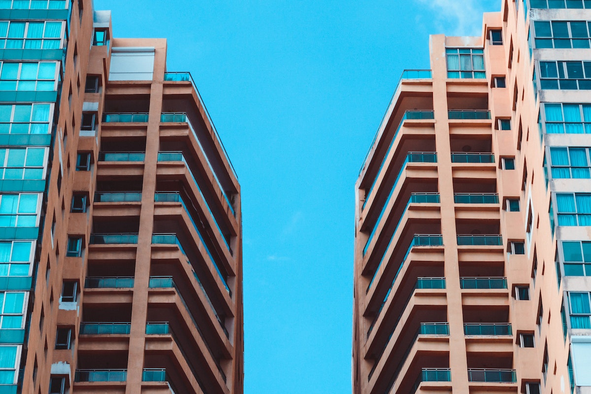 Low Angle View of Two High Rise Buildings Under Blue Sky